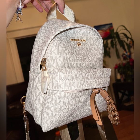 Michael Kors Handbags - Michael Kors Slater XS Convertible Messenger Vanilla/Acorn Backpack